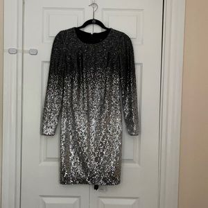 Formal long sleeve sequin knee length dress.
